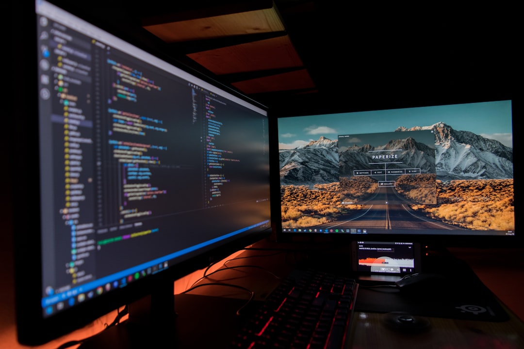 two-black-flat-screen-computer-monitors-lj9ky8pih3e